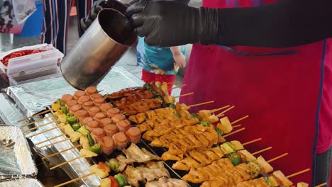 grilled skewers at a street food stall