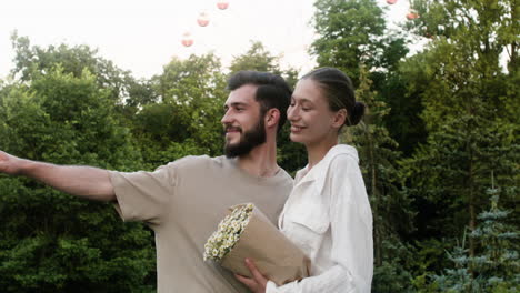 young couple kissing at the park