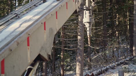 logging operation in a snowy forest