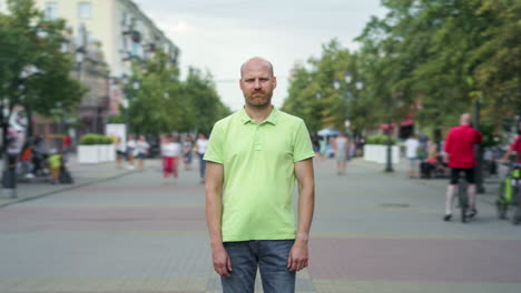 man standing on a city street