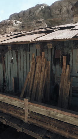 old wooden shack in mountainous terrain