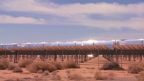 pan across a solar farm in the desert generates electricity