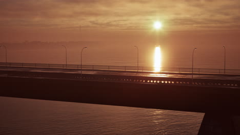 bridge at sunset with fog