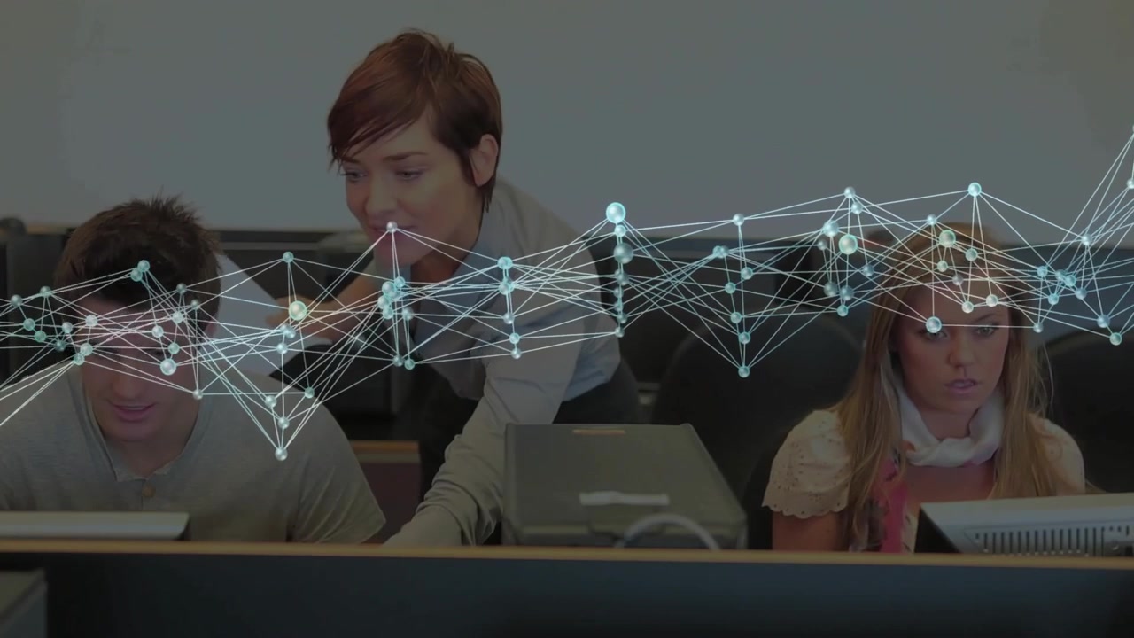 Teacher Assisting Students in Computer Lab with Digital Network Overlay