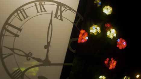 outdoor christmas decorations lantern with clock overlay, blured christmas lights flashing in background, closeup