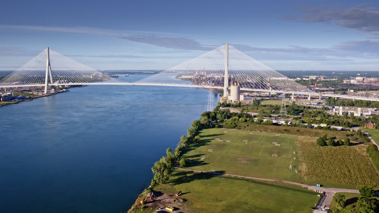 Drone glides over Gordie Howe International Bridge en route to the industrial area along the Detroit River