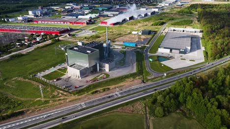 Kaunas cogeneration plant during a fire incident. Fire crews actively managing the situation
