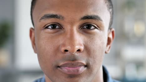 serious young african man face looking at camera