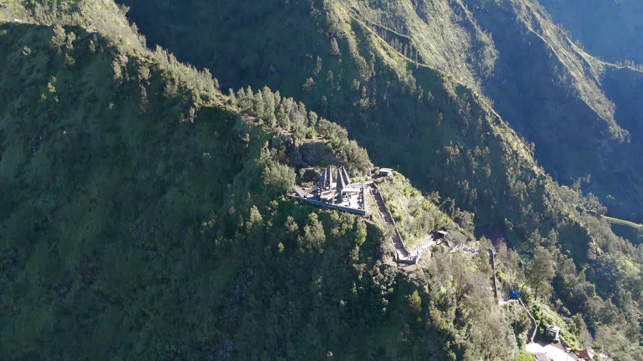 Aerial: Pura Luhur Batukaru Hindu temple during the day in Tabanan, Java, Indonesia, crane down drone shot
