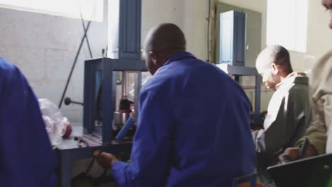 group of colleagues working in factory