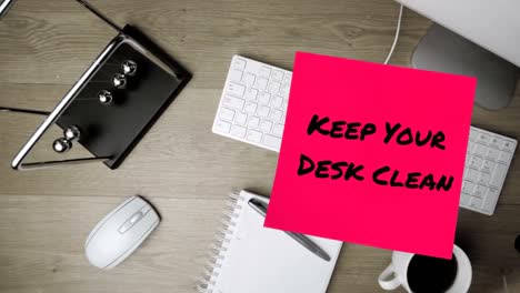 Animation-of-keep-your-desk-clean-text-over-computer-keyboard-with-notebook-and-pen