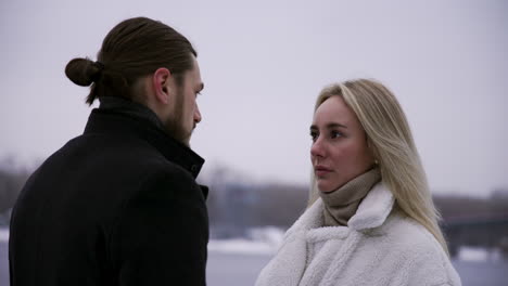 man and woman standing outdoors