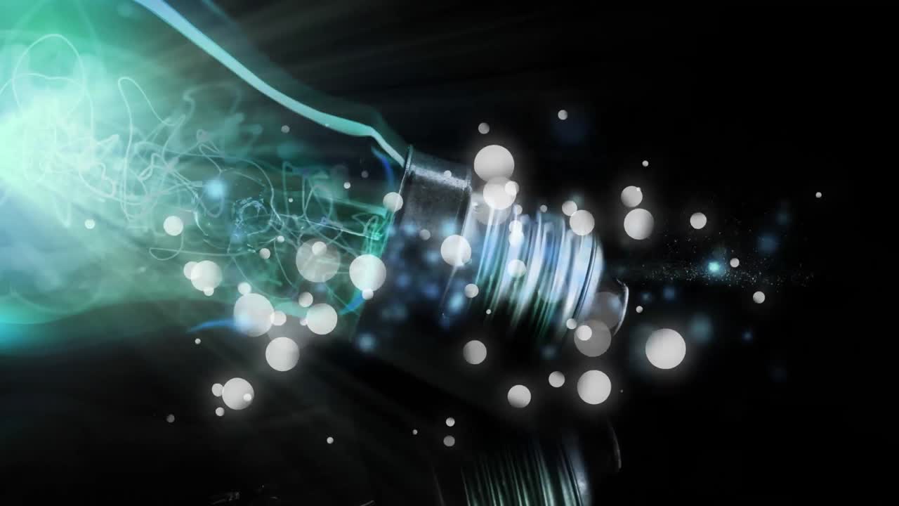 Animation of lit light bulb with glowing flickering spots and copy space