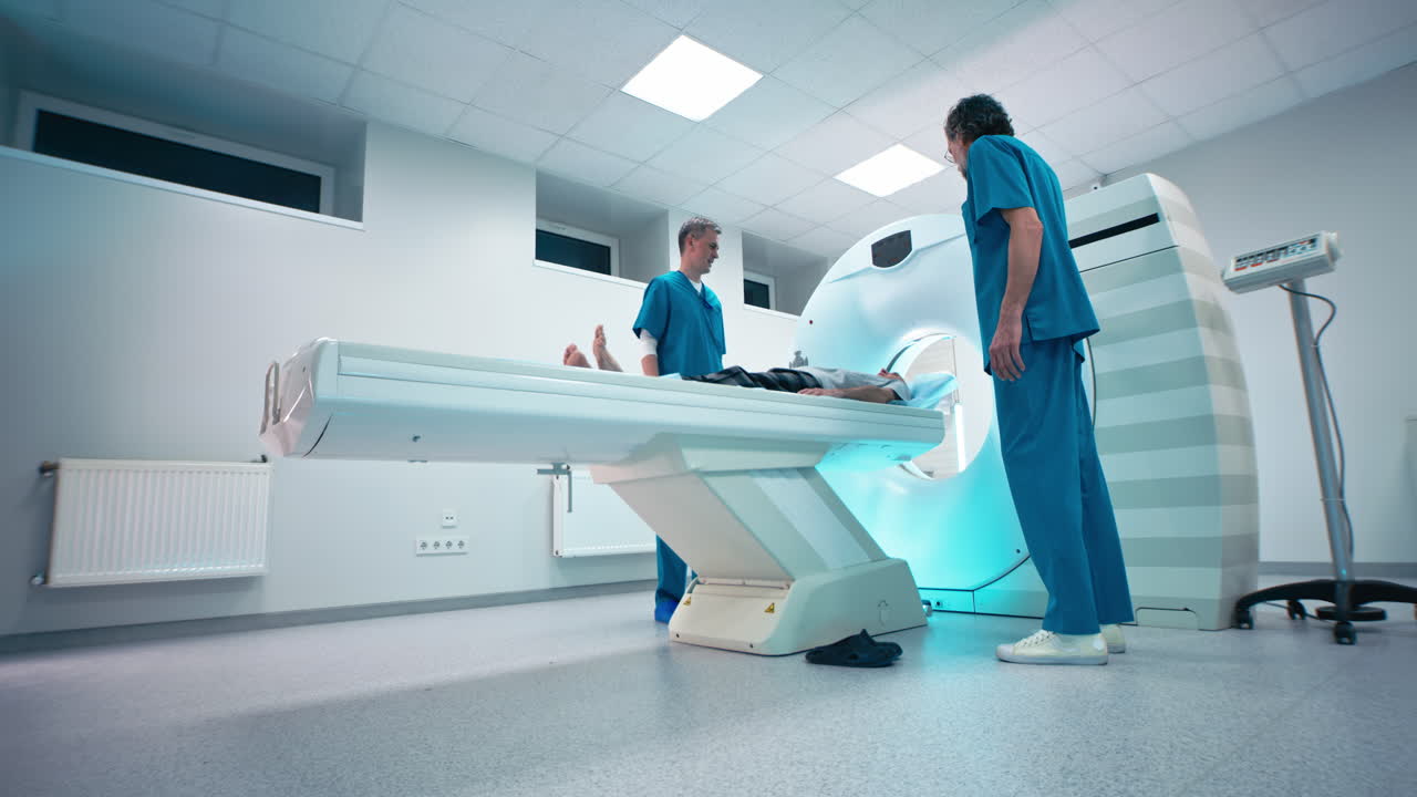 Medical Professionals Preparing Patient for CT Scan
