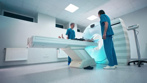 medical professionals preparing patient for ct scan