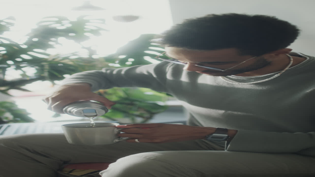 Man Having Tea at Home