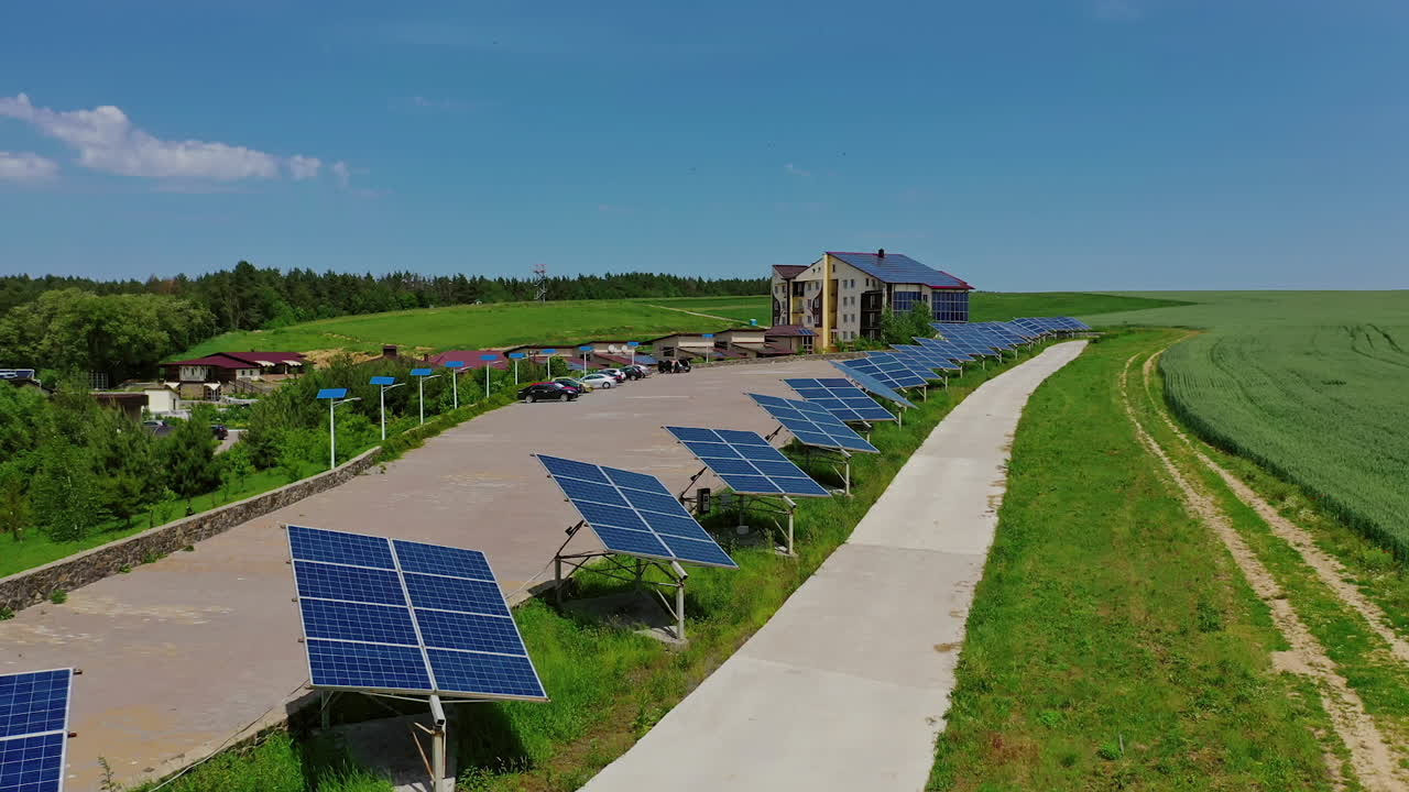 Futuristic solar panels among nature. Modern complex with sunny batteries to receive clean energy from the sun. Renewable source of energy.
