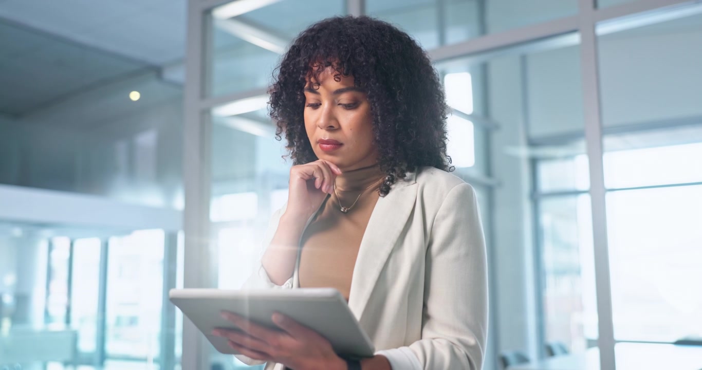 Professional Woman Using Digital Tablet in Modern Office