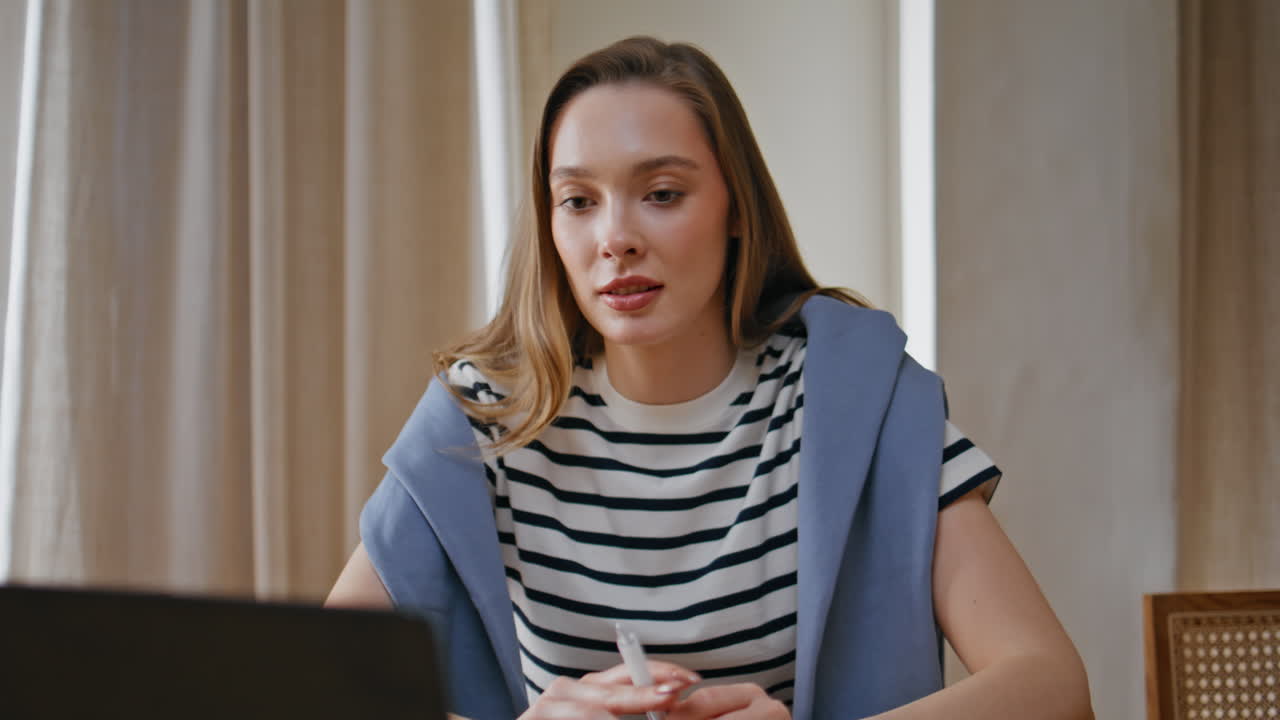 Job candidate online interview laptop in apartment closeup. Woman video calling