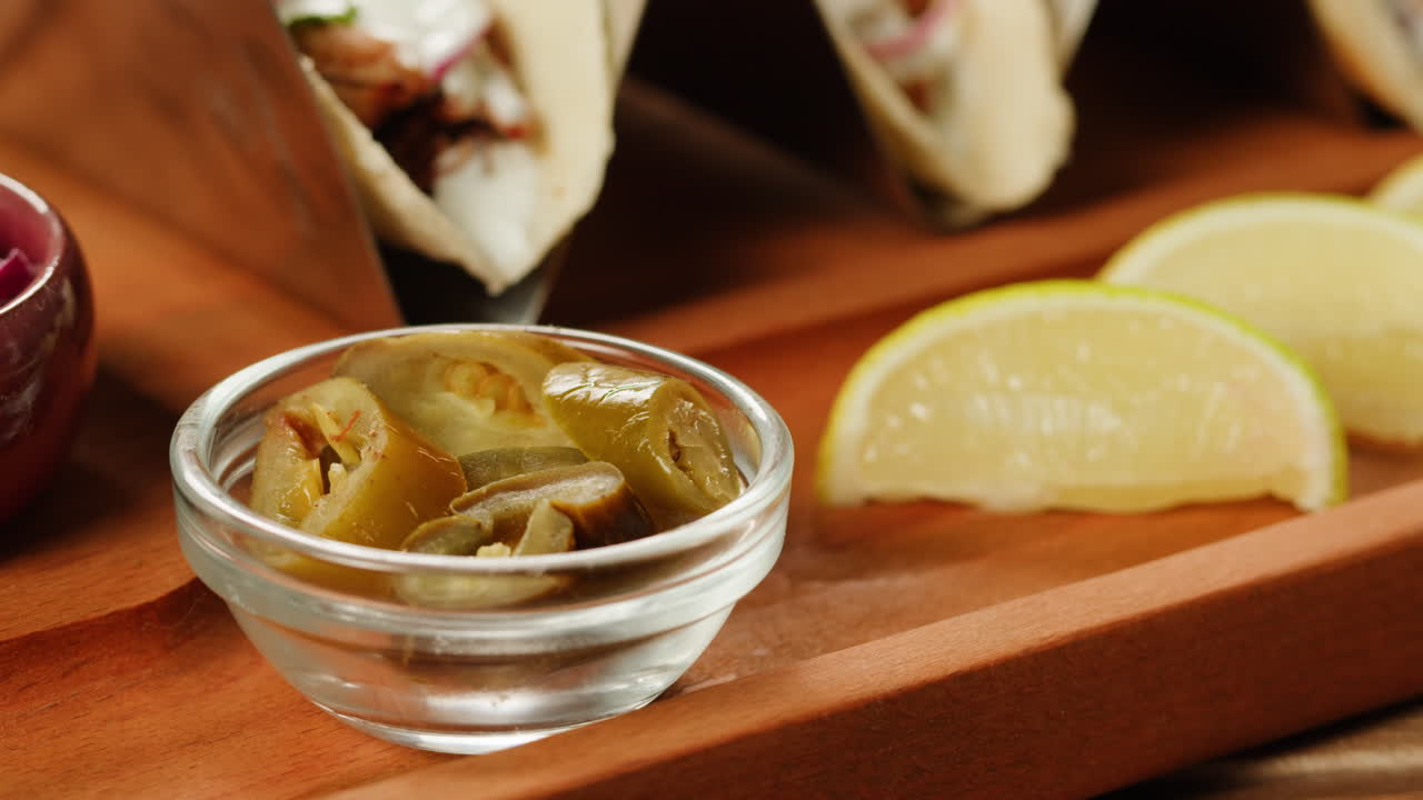 Tacos with pickled jalapenos and lime