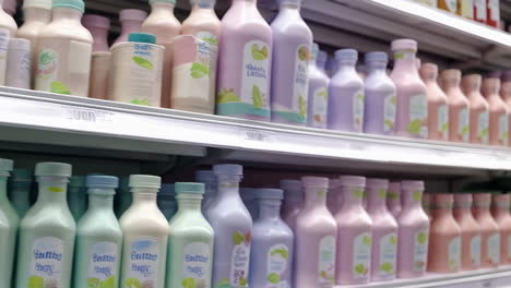 rows of colorful bottled drinks on shelves