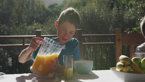 Family-eating-breakfast-together-outdoors