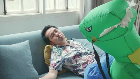 tried asian father with dinosaur toy after play with his child in modern house living room