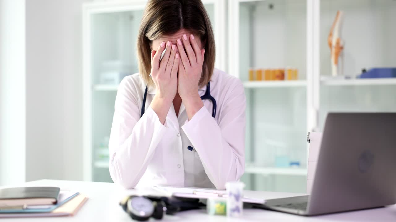 Female Doctor Explaining and Experiencing Stress in a Clinic