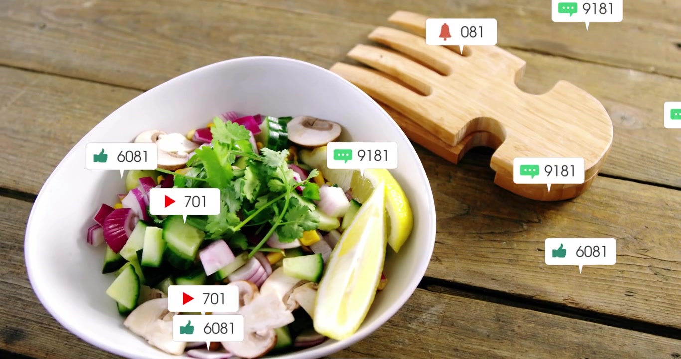 Popping social bubbles flooding salad bowl on wood table overlapping fork trivet showing engagement