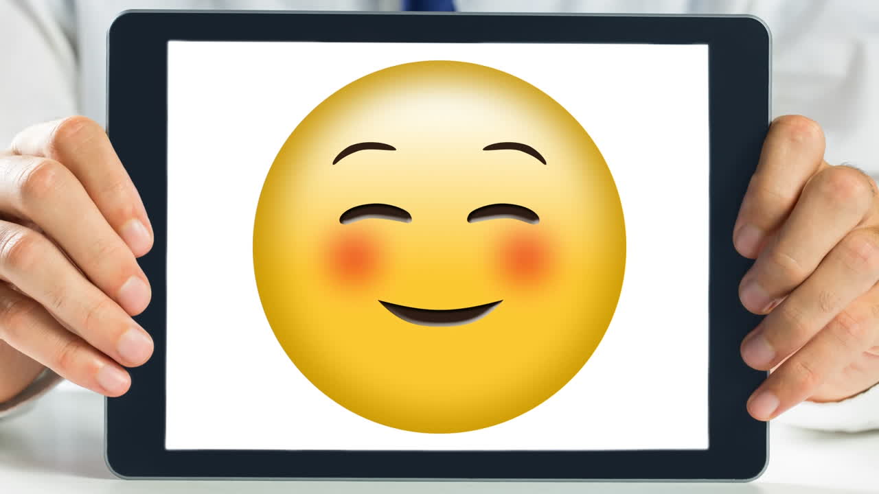Tablet che mostra un video di una faccina felice