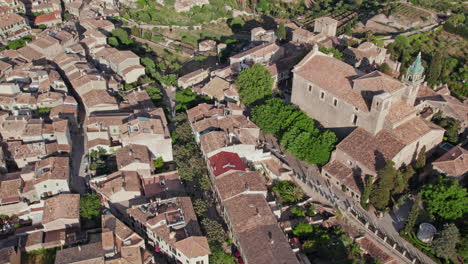 carthusian monastery of valldemossa with church tower - residence of king sancho of majorca in mallorca, spain