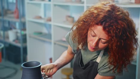 woman potter working on a vase