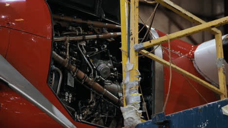 mechanics working on an airplane engine