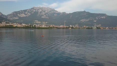 Aerial-of-Summer-in-Italy,-vacation-by-lake-Como-in-the-mountains,-Lago-di-Como,-Italy