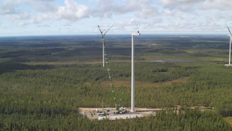 Panoramic-view-of-the-construction-site-of-wind-turbines-for-wind-power-generation,-drone-shot