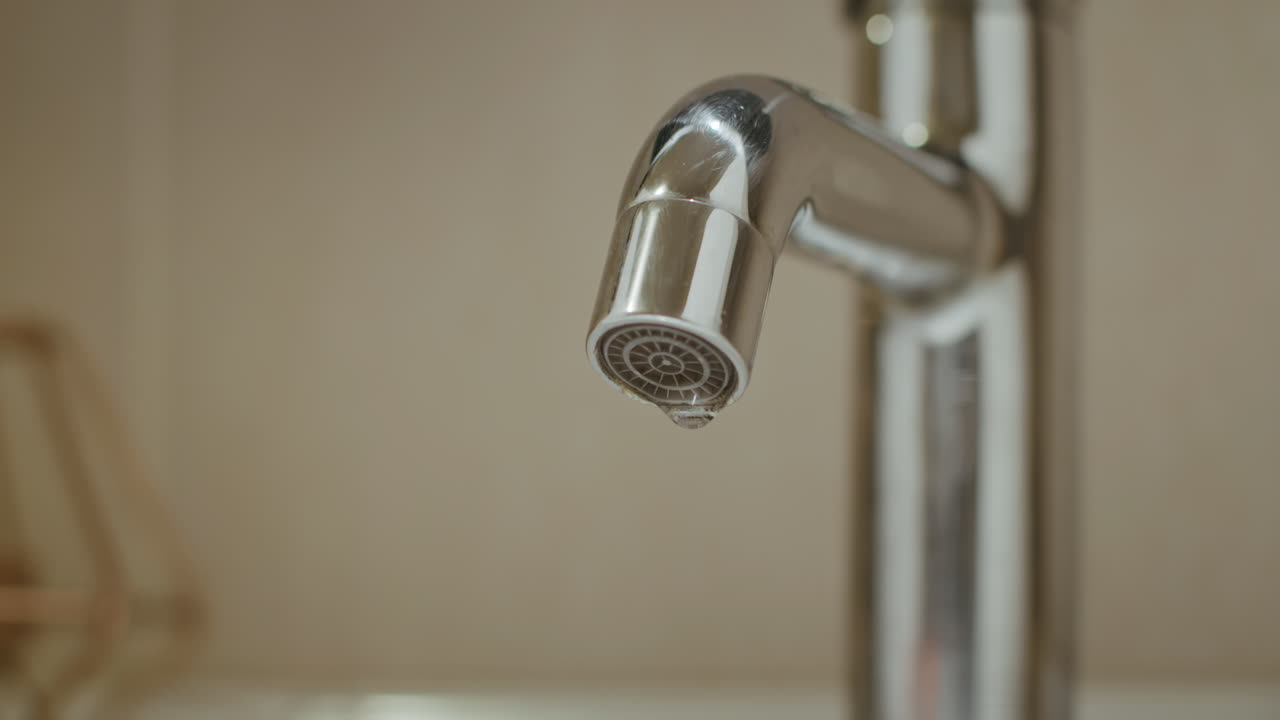 Dripping Water Tap from Leaky Faucet warns us about Environmental Conservation, Water Saving and Global Warming