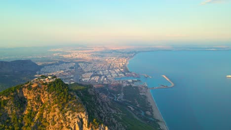 Aerial-4K-drone-video-of-a-Tunektepe-Teleferik
Cable-station-positioned-on-top-of-the-hill-with-the-mountains-in-the-background