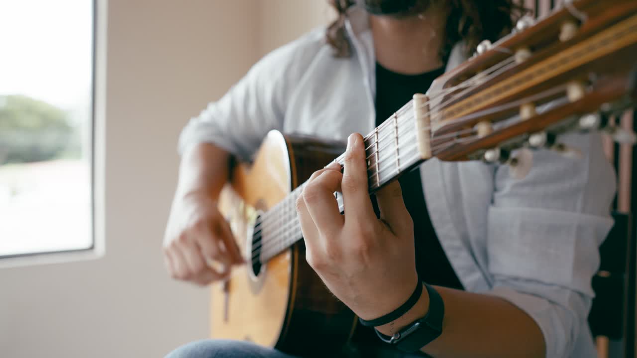 Person playing a classical guitar