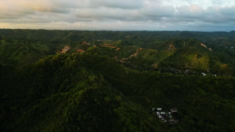 Aerial-circling-Guest-house-in-green-valley-at-sunset,-Kuta,-Lombok,-Indonesia