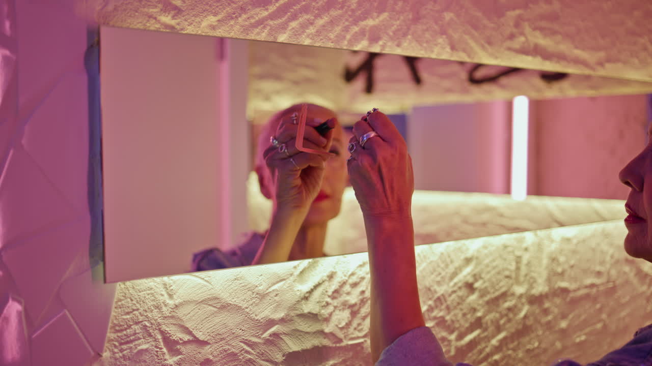 Woman writing lipstick mirror in reflection closeup. Romantic senior draw love