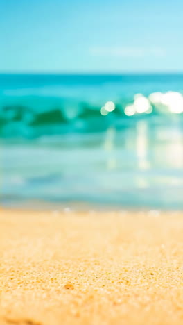 blurred beach scene with ocean and sand