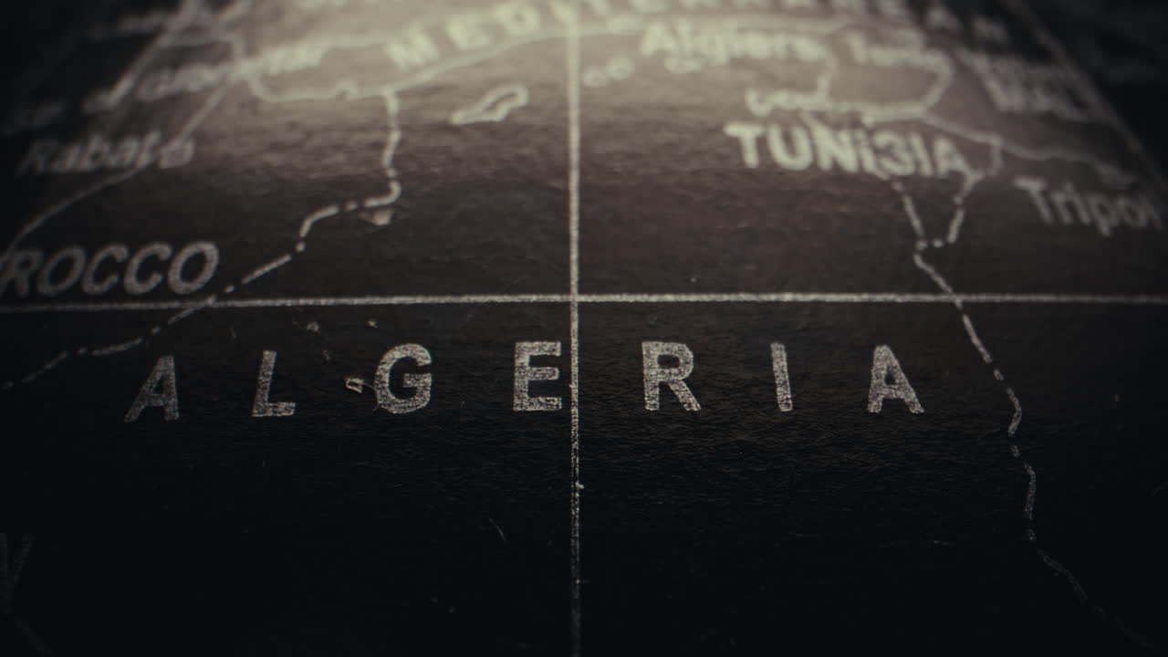 Close-up of a World Globe Focusing on Algeria and Surrounding Countries