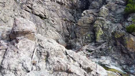 Aerial-footage-of-a-river-hidden-between-rocks-in-the-Balkan-mountains-near-the-town-of-Sopot,-Bulgaria