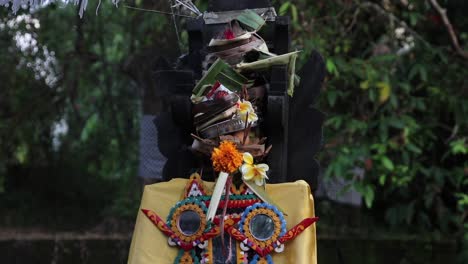 incense burning outside a balinese temple in canggu, bali as part of a hindu ceremony to the gods.