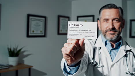 doctor holding business card