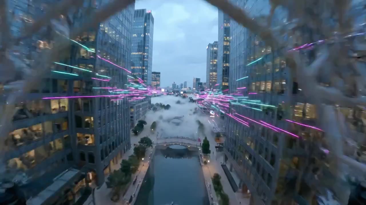 Aerial View of a Modern Cityscape with Fog and Illuminated Buildings Highlighting a Vibrant Urban Environment at Dusk