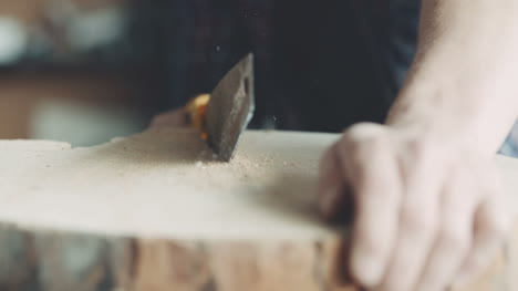 Carpenter-Cutting-Wood-With-Handsaw-In-Workshop-2