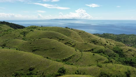 teletubbies hill landscape with rolling green hills under a blue sky