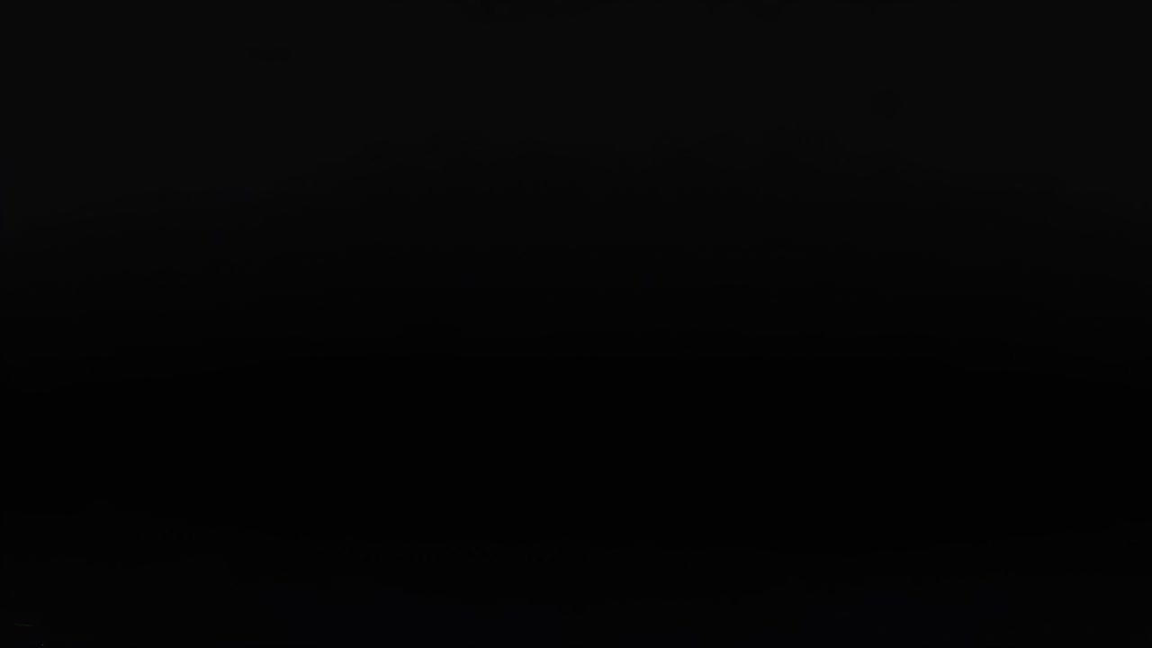 White spheres positioned within a grid pattern against a dark backdrop, showcasing spatial arrangement and contrast.