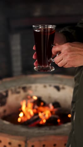 warm mulled wine by a cozy fireplace